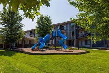 A blue slide in a playground